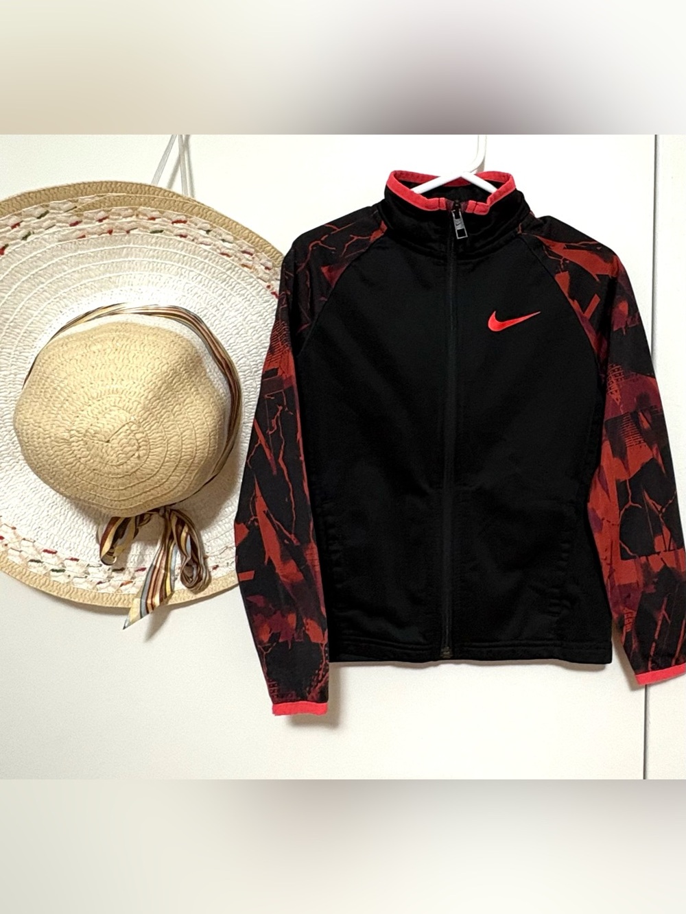 Nike Black Jacket with Red Swoosh and Red-Patterned Sleeves